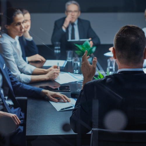 An individual preparing a persuasive pitch for investors, conveying urgency and determination to succeed.